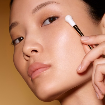 photo of woman applying re nutriv age reversal eye creme age reversal technique