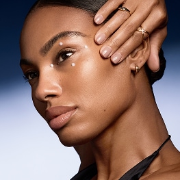 photo of model using eye cream to care for dynamic vs static lines