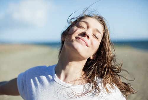 photo of woman on the beach biohacking