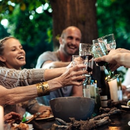 photo of group of friends cheering with glasses why longevity matters