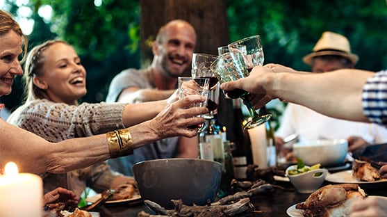 photo of group of friends cheering with glasses why longevity matters