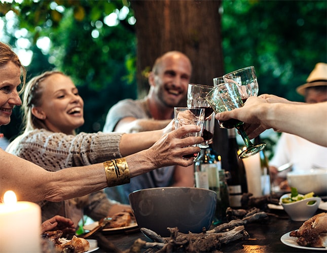 photo of group of friends cheering with glasses why longevity matters